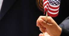 Child Hand Waving American Flag