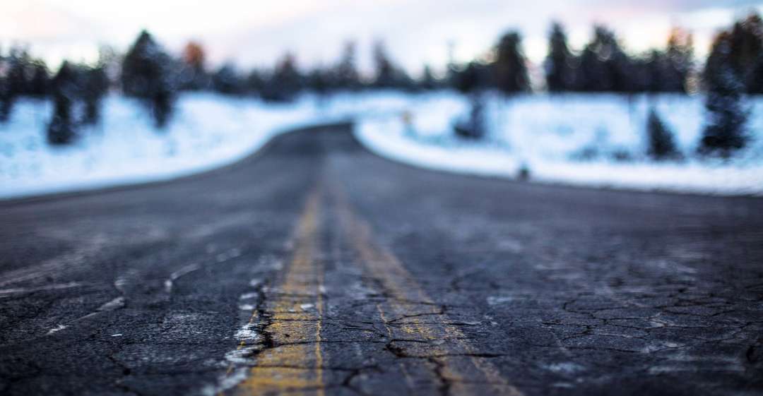 Cracked road with snow.