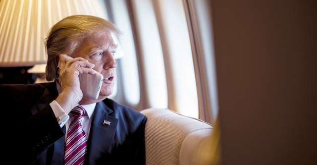 President Donald Trump talks on the phone aboard Air Force One during a flight to Philadelphia, Pennsylvania, to address a joint gathering of House and Senate Republicans, Thursday, January 26, 2017. This was the President’s first trip aboard Air Force One. (Official White House Photo by Shealah Craighead)
