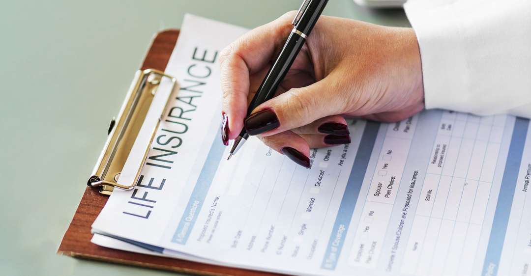 Filling out life insurance paperwork.