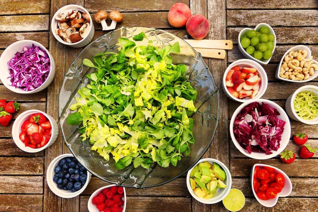 Bowl of salad and fresh vegetables.