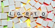 LGBTQ spelled out with scrabble pieces.