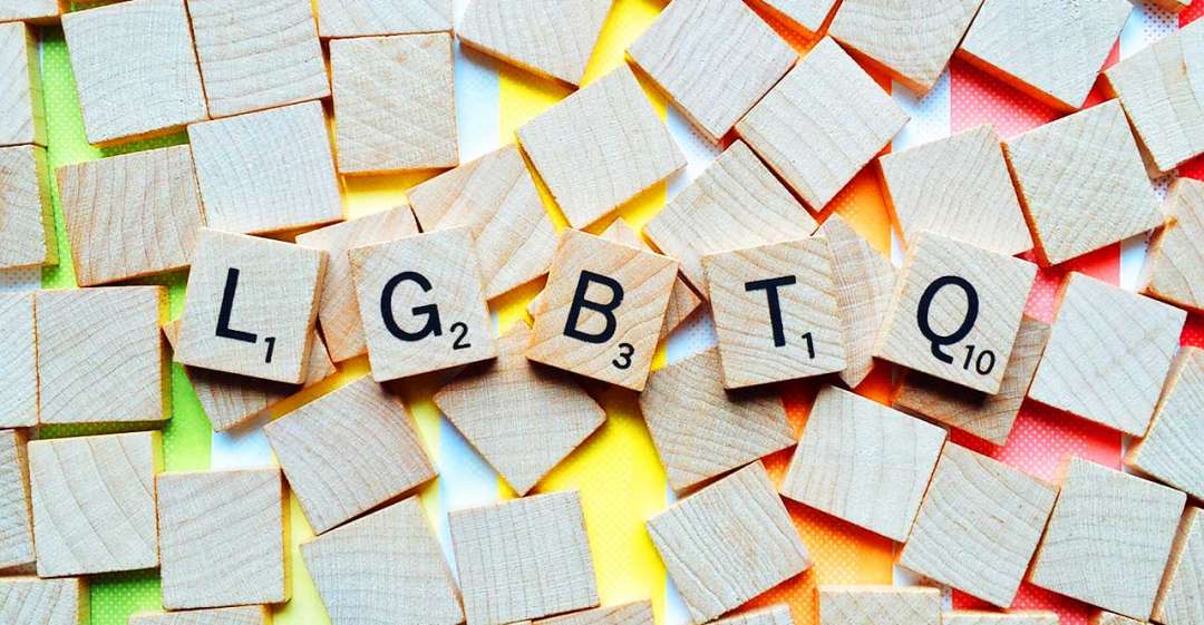 LGBTQ spelled out with scrabble pieces.