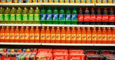 Aisle filled with soda.