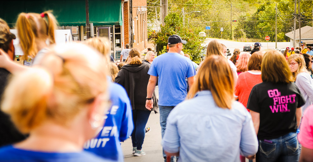 Man walking in crowd.