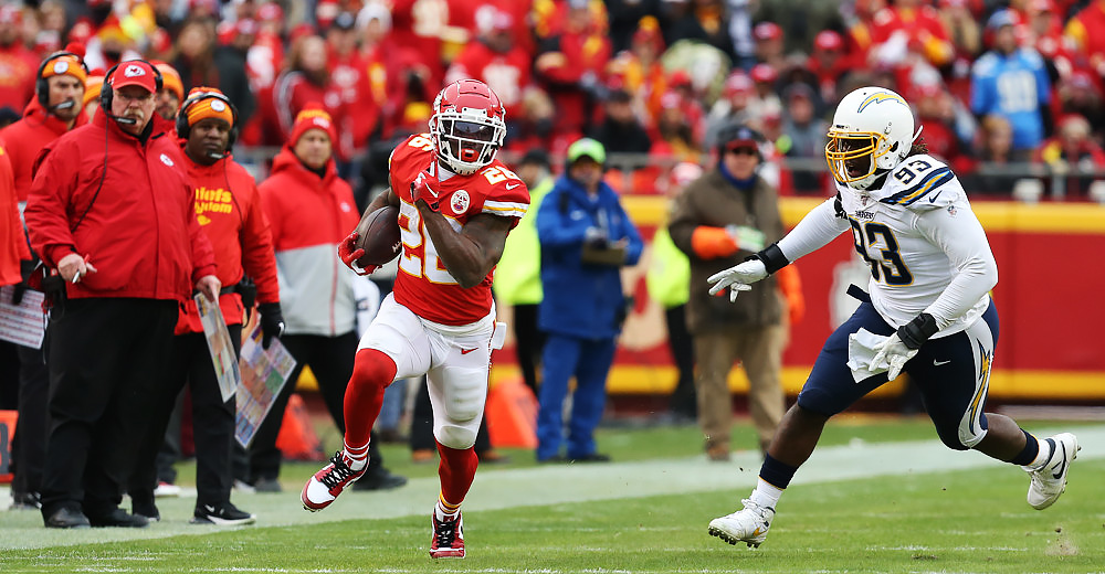 KANSAS CITY, MO - DECEMBER 29: Kansas City Chiefs running back Damien Williams (26) is pursued by Los Angeles Chargers defensive tackle Justin Jones (93) during a run in the second quarter of an AFC West game between the Los Angeles Chargers and Kansas City Chiefs on December 29, 2019 at Arrowhead Stadium in Kansas City, MO. (Photo by Scott Winters/Icon Sportswire)