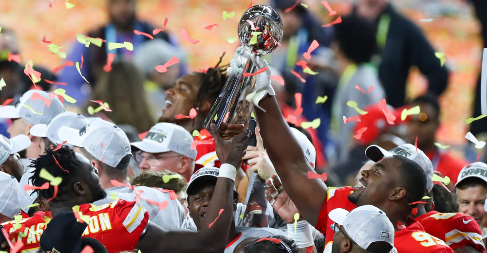 MIAMI GARDENS, FL - FEBRUARY 02: Kansas City Chiefs Defensive Tackle Chris Jones (95) holds up the Vince Lombardi Trophy on the podium after Super Bowl LIV on February 2, 2020 at Hard Rock Stadium in Miami Gardens, FL. (Photo by Rich Graessle/PPI/Icon Sportswire)