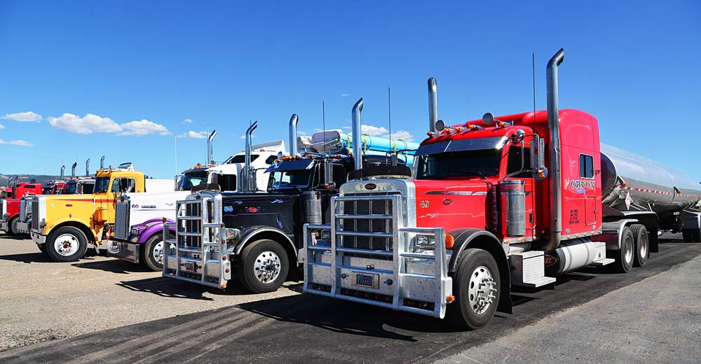 Semi trucks in parking lot.