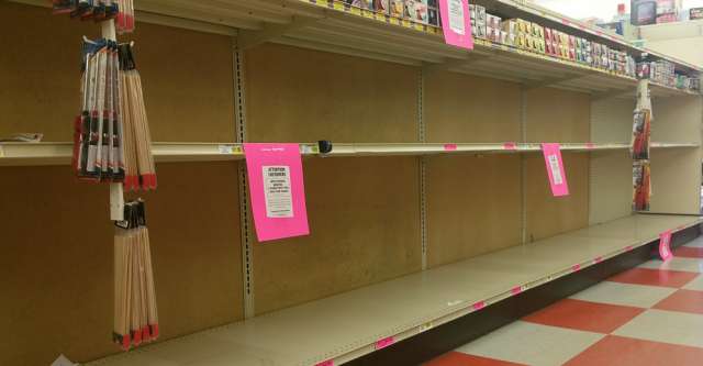 Harps grocery store with empty shelves.