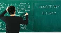 Boy trying to solve the equation on the blackboard