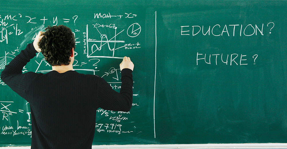 Boy trying to solve the equation on the blackboard