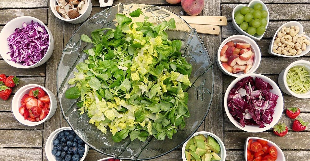 Green salad with multiple toppings.