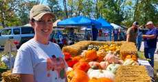 Stefanie Hobson of Patchwork Farms shows off her beautiful pumpkins, squash and mums.