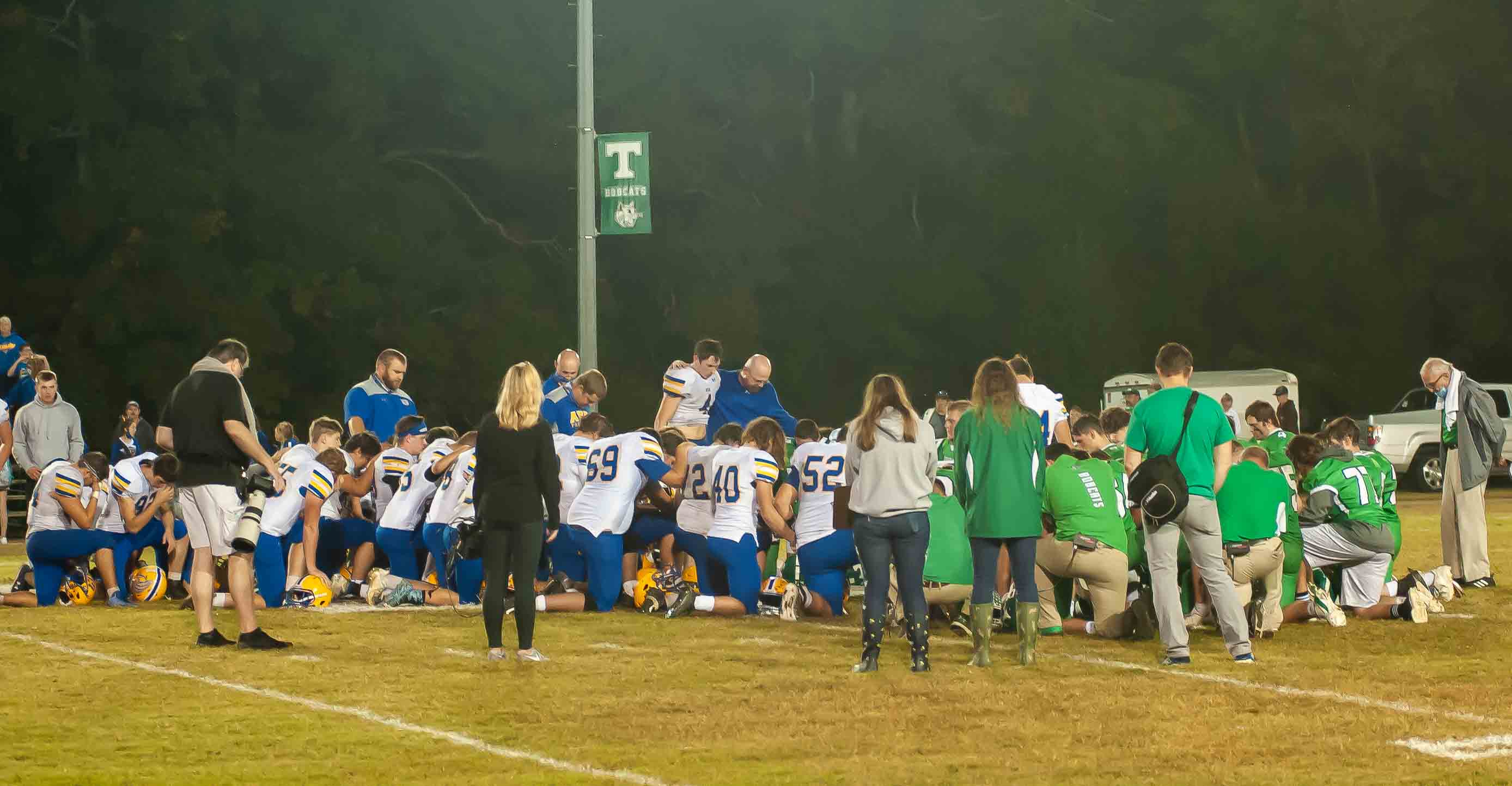 THAYER, MO - OCTOBER 9: Thayer Bobcats and Ava Bears coaching staff and players pray together after the game during the high school football game between the Ava Bears and the Thayer Bobcats on October 9, 2020, at the Thayer High School football field in Thayer, MO. (Photo by Curtis Thomas/AltonMo.com)