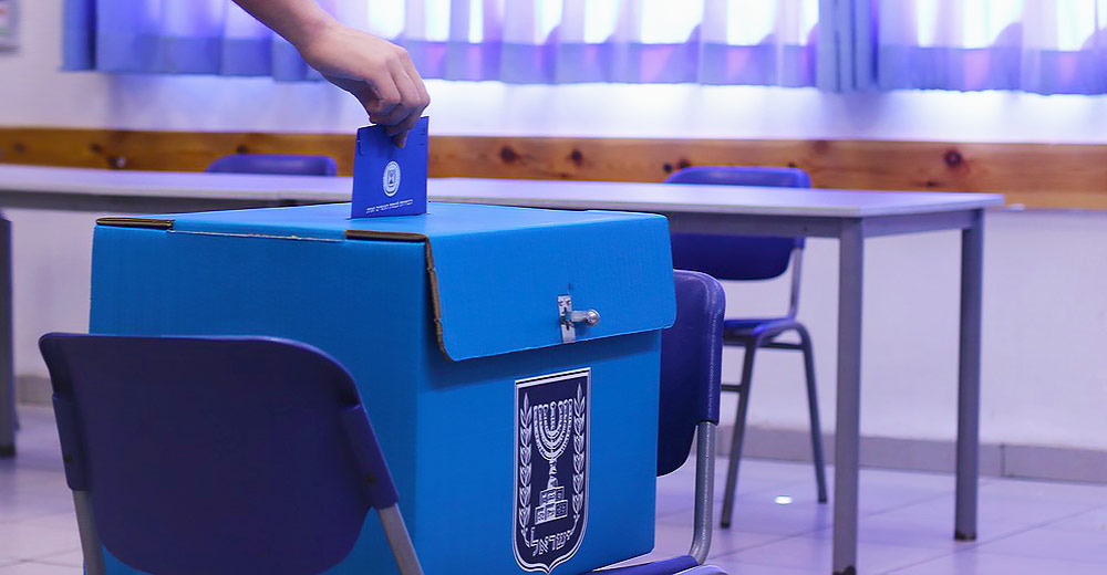 Person voting at a voting box