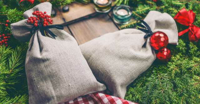Christmas bags on evergreen branches.
