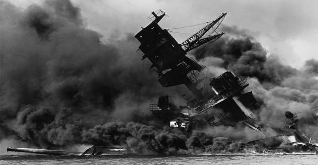The USS Arizona sinking at Pearl Harbor.