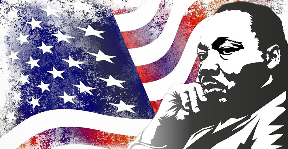 Martin Luther King Jr. in front of the American flag.