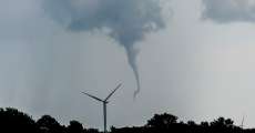 A tornado beginning as a funnel cloud