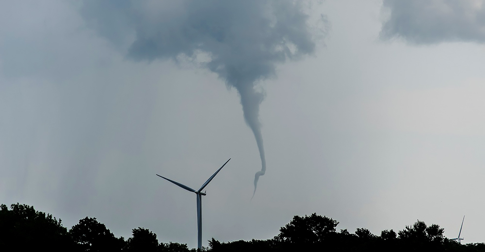 A tornado beginning as a funnel cloud