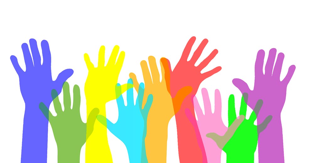 volunteer hands raised