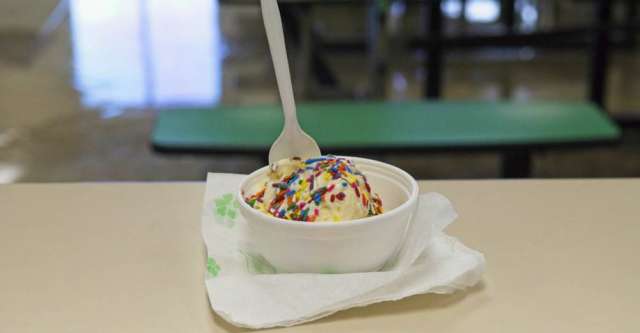 A bowl of ice cream with sprinkles on top.