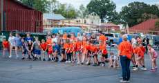 One mile race participants line up at the starting line during the 36th annual Ozark “Black Gold” Walnut Festival.