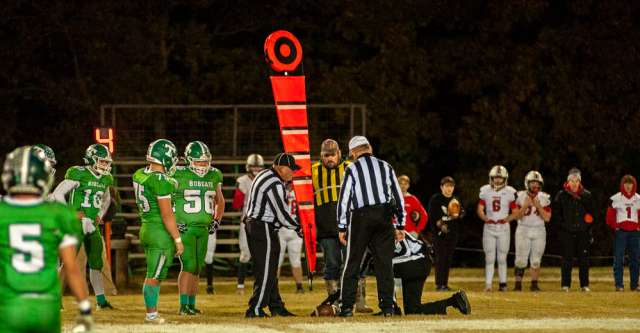 THAYER, MO – NOVEMBER 5: The referees take an official time out to take a measurement during the high school football game between the Thayer Bobcats and the Ash Grove Pirates on November 5, 2021, at the Thayer High School football field in Thayer, MO. (Photo by Curtis Thomas/AltonMo.com)