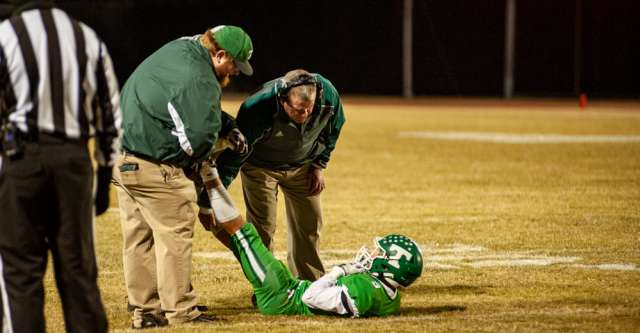 THAYER, MO – NOVEMBER 5: Thayer Bobcats wide receiver Rowan Spencer (9) gets help from the medical staff during the high school football game between the Thayer Bobcats and the Ash Grove Pirates on November 5, 2021, at the Thayer High School football field in Thayer, MO. (Photo by Curtis Thomas/AltonMo.com)