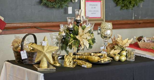 A golden-themed table with a multi-candlestick holder.