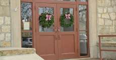 Doors with wreaths on them.