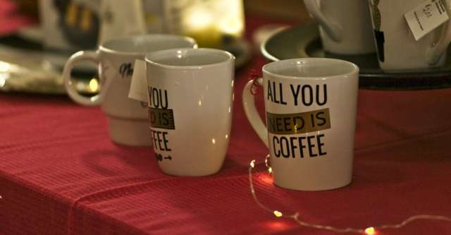 "All You Need Is Coffee" cups on sale.