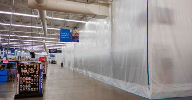 Tarps covering the area where the fire happened at the West Plains Walmart.