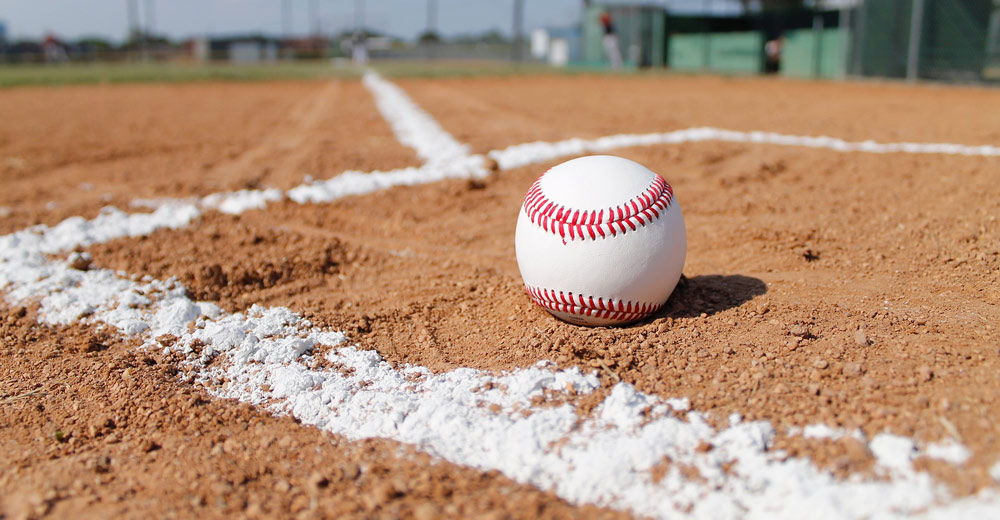 A baseball on dirt