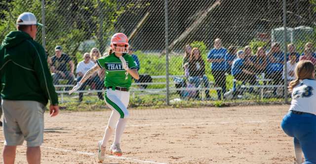 ALTON, MO – APRIL 26: Thayer Bobcats previous batter (2) sprints to first base during the high school softball game between the Alton Comets and the Thayer Bobcats on April 26, 2022, at the Alton High School softball field in Alton, MO. (Photo by Curtis Thomas/AltonMo.com)