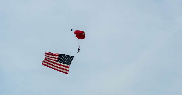 Skydiver with the American flag at Thayer Mo. on 4th of July