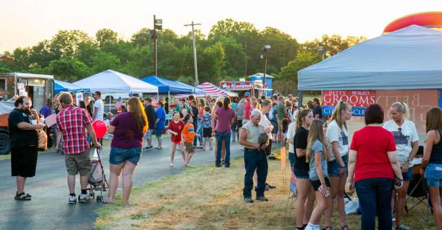 People walking around at the Alton 1st of July Fireworks.