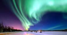 The aurora borealis in the northern night sky.
