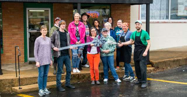 People (including Laurel Johnson, Hope Rackley, Caty Chilcutt, Randall and Becky Combs, Thomas Sallings, Diana Clary, and Amanda Thomas) present at Court Square Cafe's grand opening.