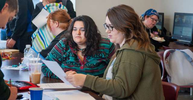 College students grading the quizzes at MSU-West Plains Pi Day.