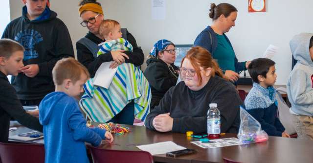 College students measuring the circles for a 3.14 circle at MSU-West Plains Pi Day.