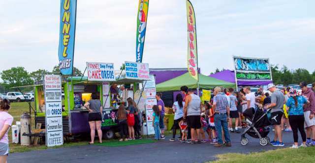 People waiting in line for funnel cakes and lemonade at the Alton Independence Day celebration on July 3, 2023.