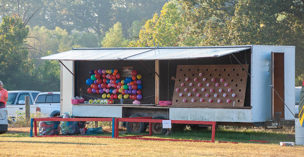 Kids games including darts, balloons, ping pong balls, and cups are ready to be played at the Myrtle Yester-Daze event on September 30, 2023.