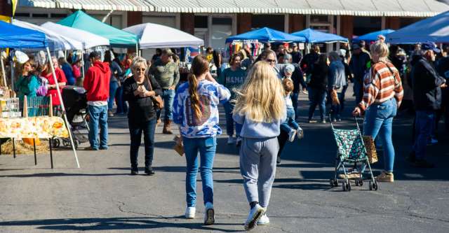 People of all ages walk around the square at the Walnut Festival on October 7, 2023.