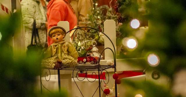 A doll and a toy truck sitting on a rack at the Thomasville Christmas Bazaar on November 10, 2023.