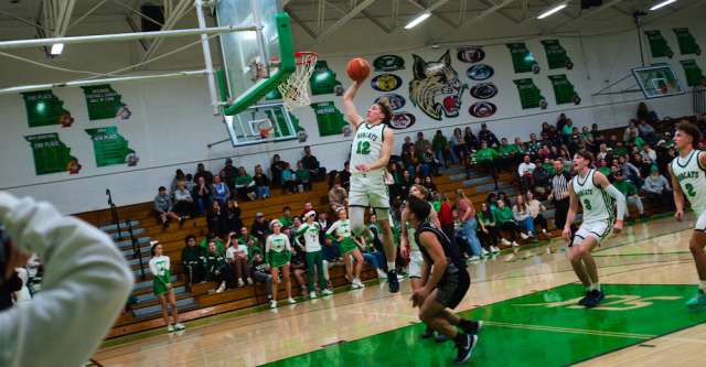 THAYER, MO – DECEMBER 18: Thayer Bobcats Aidan Burns makes a one-hand dunk during the high school basketball game between the Thayer Bobcats and the Izard County Cougars on December 18, 2023 at the Thayer High School Gym in Thayer, Missouri. (Photo by Amanda Thomas/AltonMo.com)