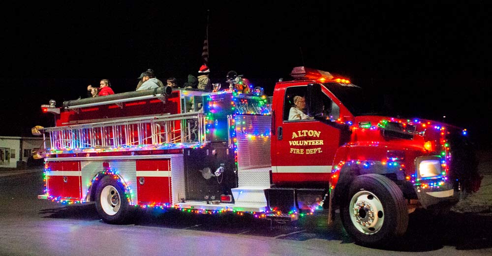 An Alton Fire Department firetruck participates in the Alton Christmas parade on December 2, 2023.