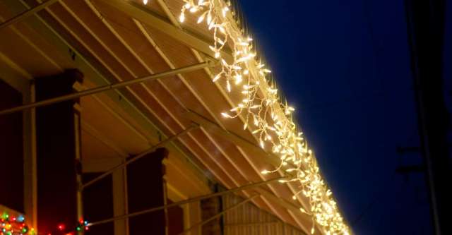 White Christmas lights adorning a roof
