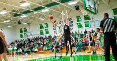 THAYER, MO – DECEMBER 18: Thayer Bobcats Devin Harrington (3) soars through the air with the ball to get a two-pointer during the high school basketball game between the Thayer Bobcats and the Izard County Cougars on December 18, 2023 at the Thayer High School Gym in Thayer, Missouri. (Photo by Amanda Thomas/AltonMo.com)