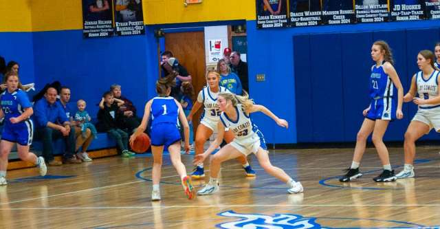 ALTON, MO – JANUARY 29: Bakersfield Lions Abbigail Guffey (1) tries to dribble around a Comet during the high school basketball game between the Alton Comets and the Bakersfield Lions on January 29, 2024, at the Alton High School Gym in Alton, Missouri. (Photo by Amanda Thomas/AltonMo.com)